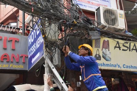 electrician fixing wires post